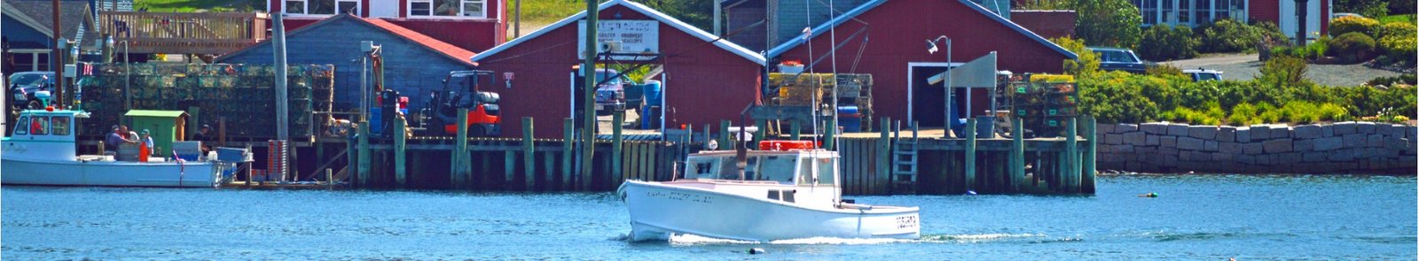 Lobster boat leaving harbor.